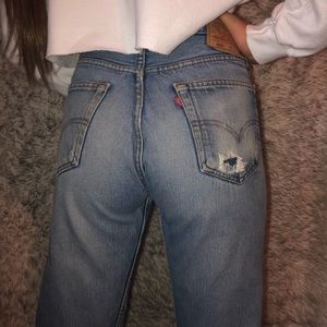 Vintage and distressed Levi 501 jeans